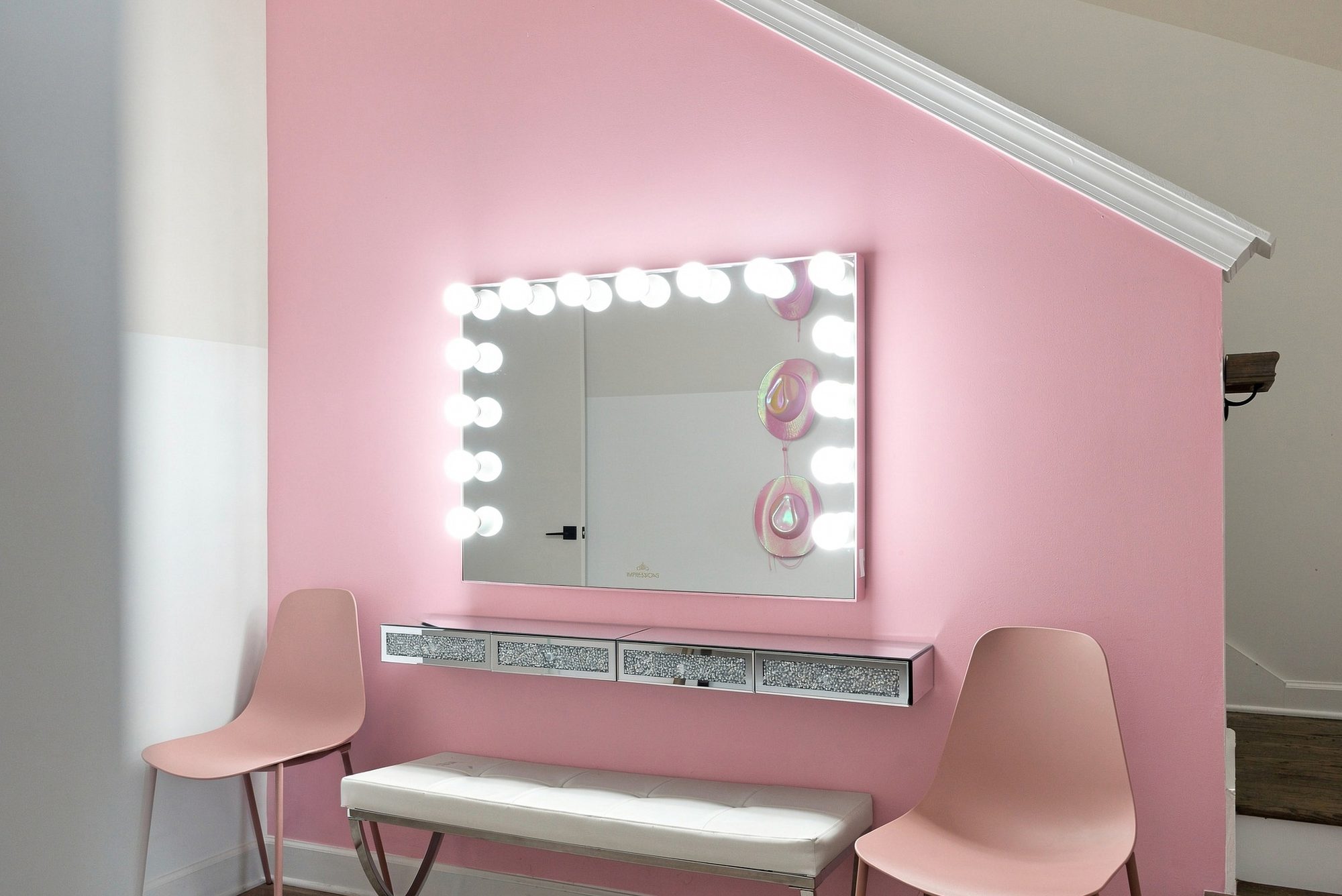 Lit vanity in a themed suite